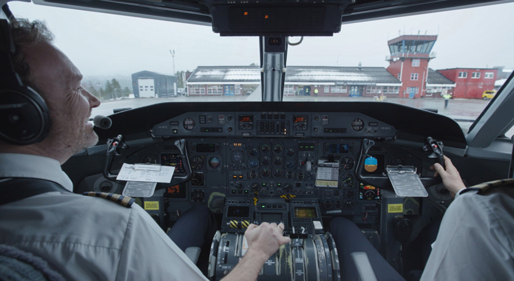 An airplane captain in the cockpit